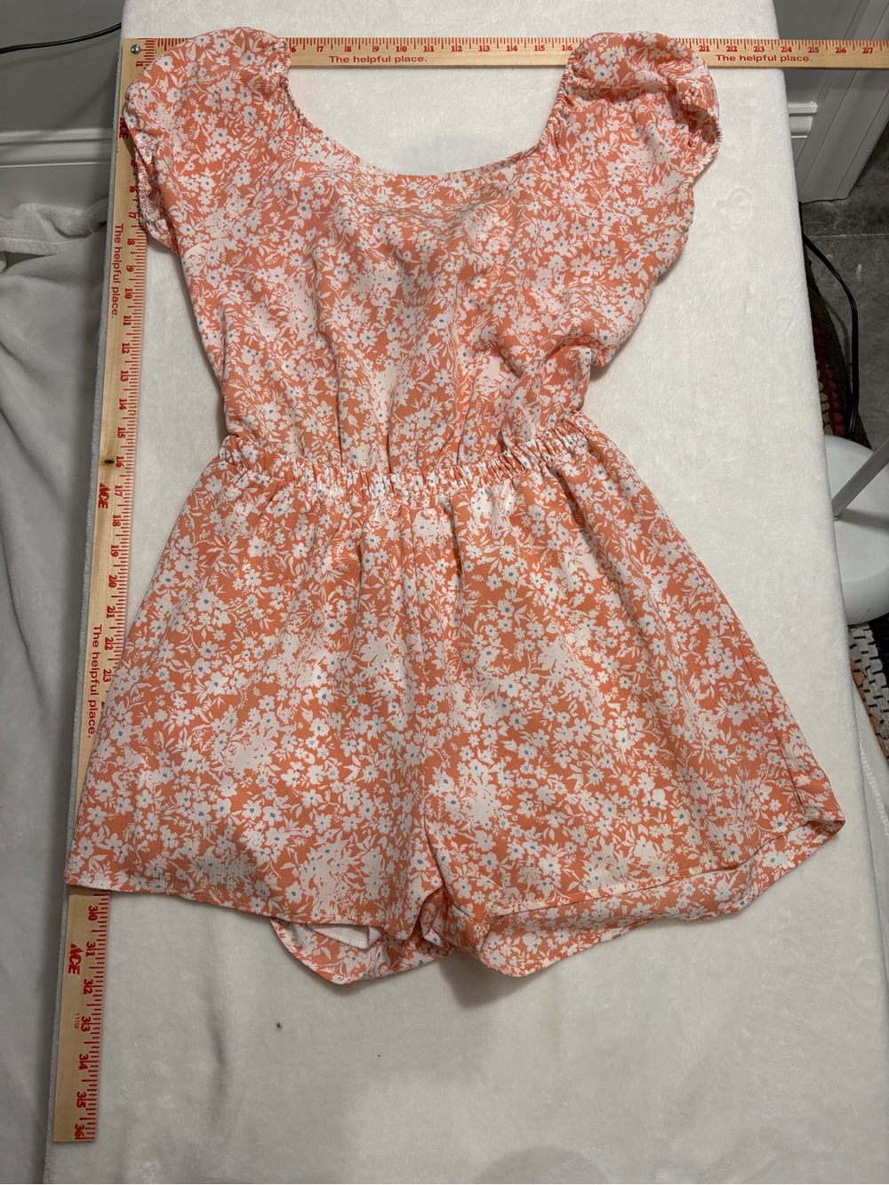 Everly Floral Puff-Sleeve One-Piece Romper in Peach, with a tie back